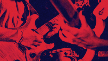 Electric guitar being played live, symbolising key turning points that shaped the evolution of popular music