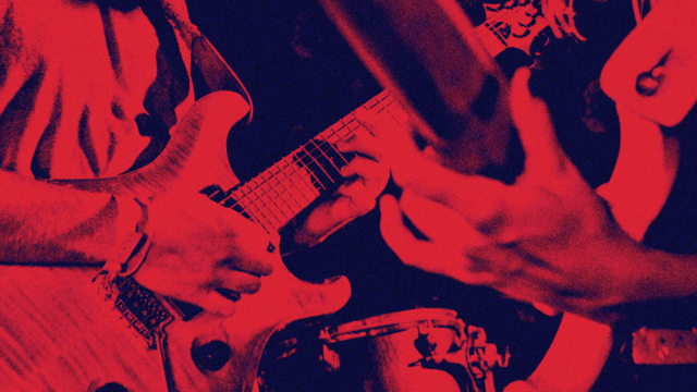 Electric guitar being played live, symbolising key turning points that shaped the evolution of popular music