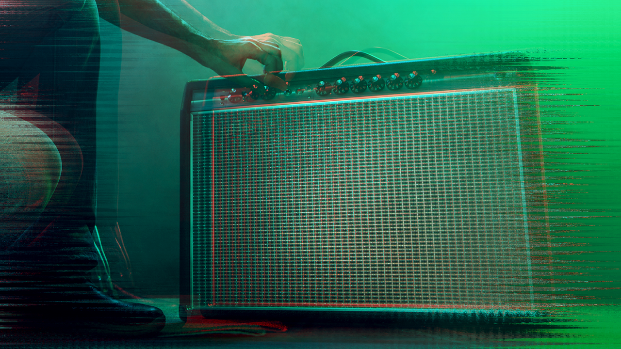 Person adjusting knobs on a guitar amplifier with green stage lighting, illustrating amp noise troubleshooting.