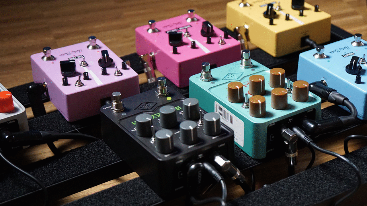 Colorful guitar pedals and power supply units connected on a pedalboard setup. What is a pedalboard power supply and why should you use one?