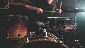The Greatest Drum Solos of All Time, header image for famous drummers performing iconic drum solos, including rock, jazz, and fusion legends.